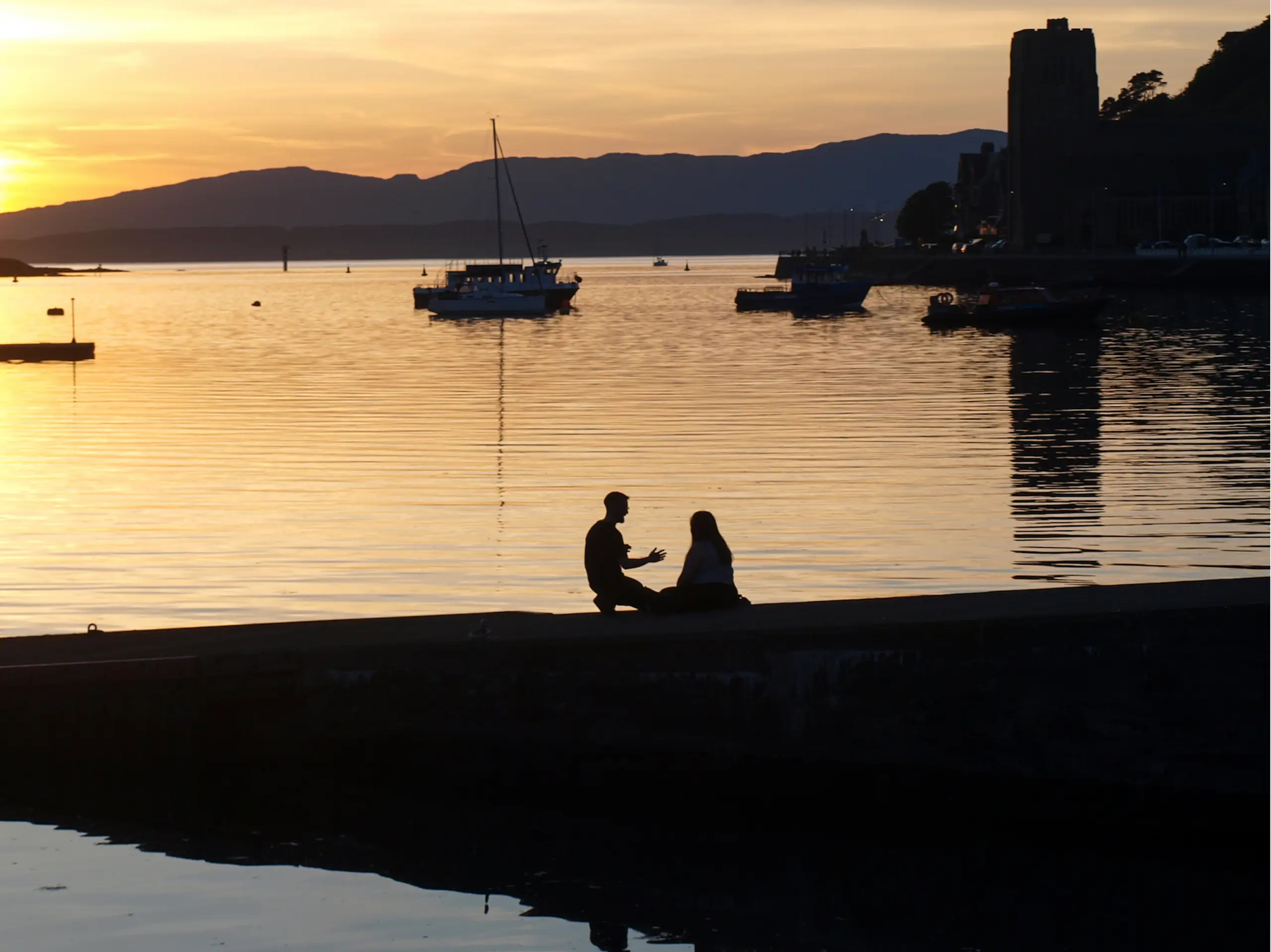 A young couple with the Roman Catholic Cathedral beyond