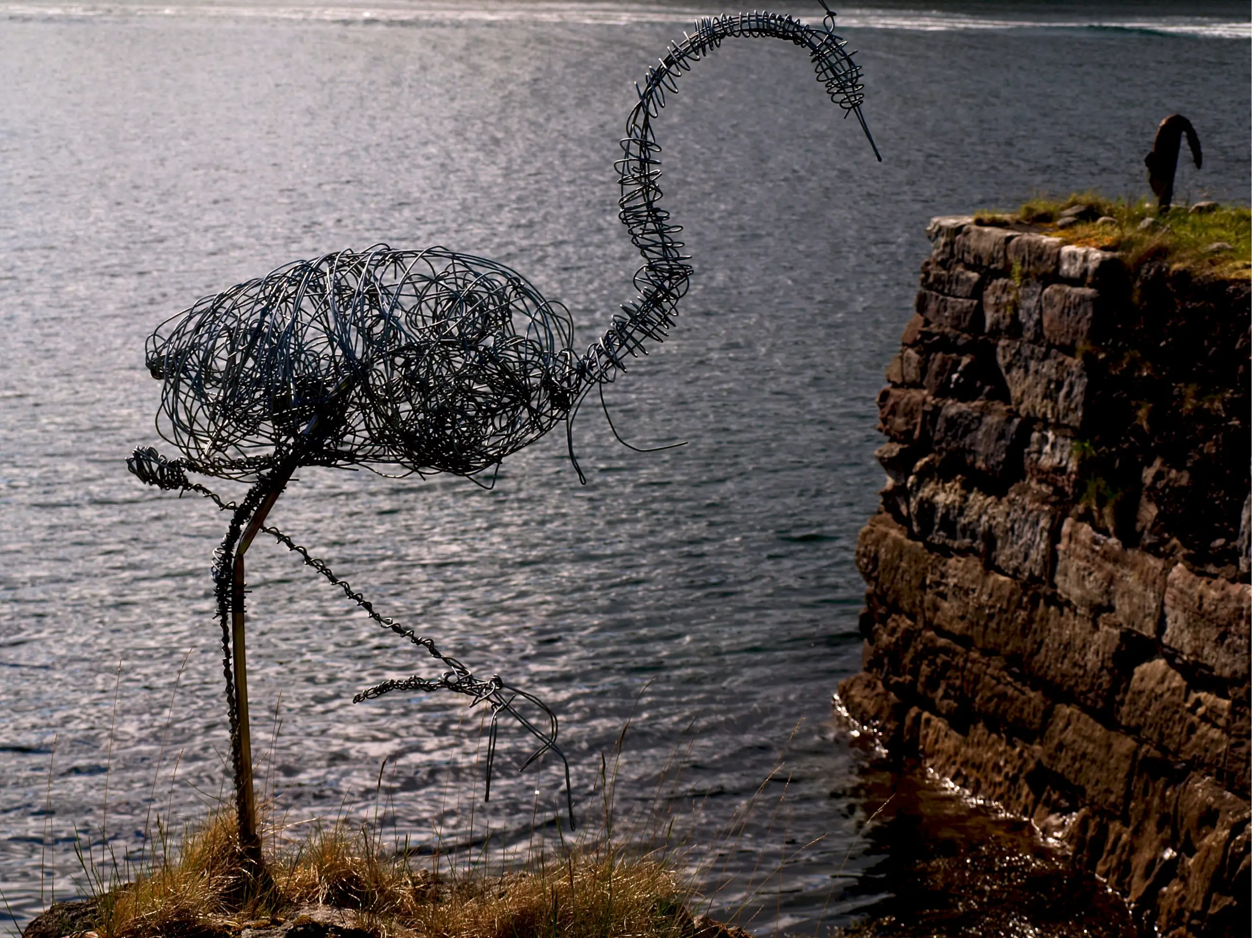The wire heron on the starboard side of the entrance to the loch