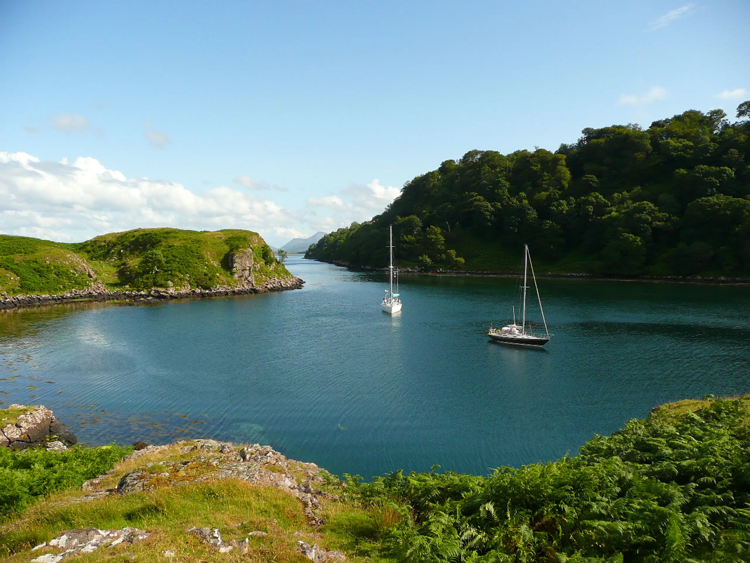The narrow southern entrance to Tobermory Bay is in the background