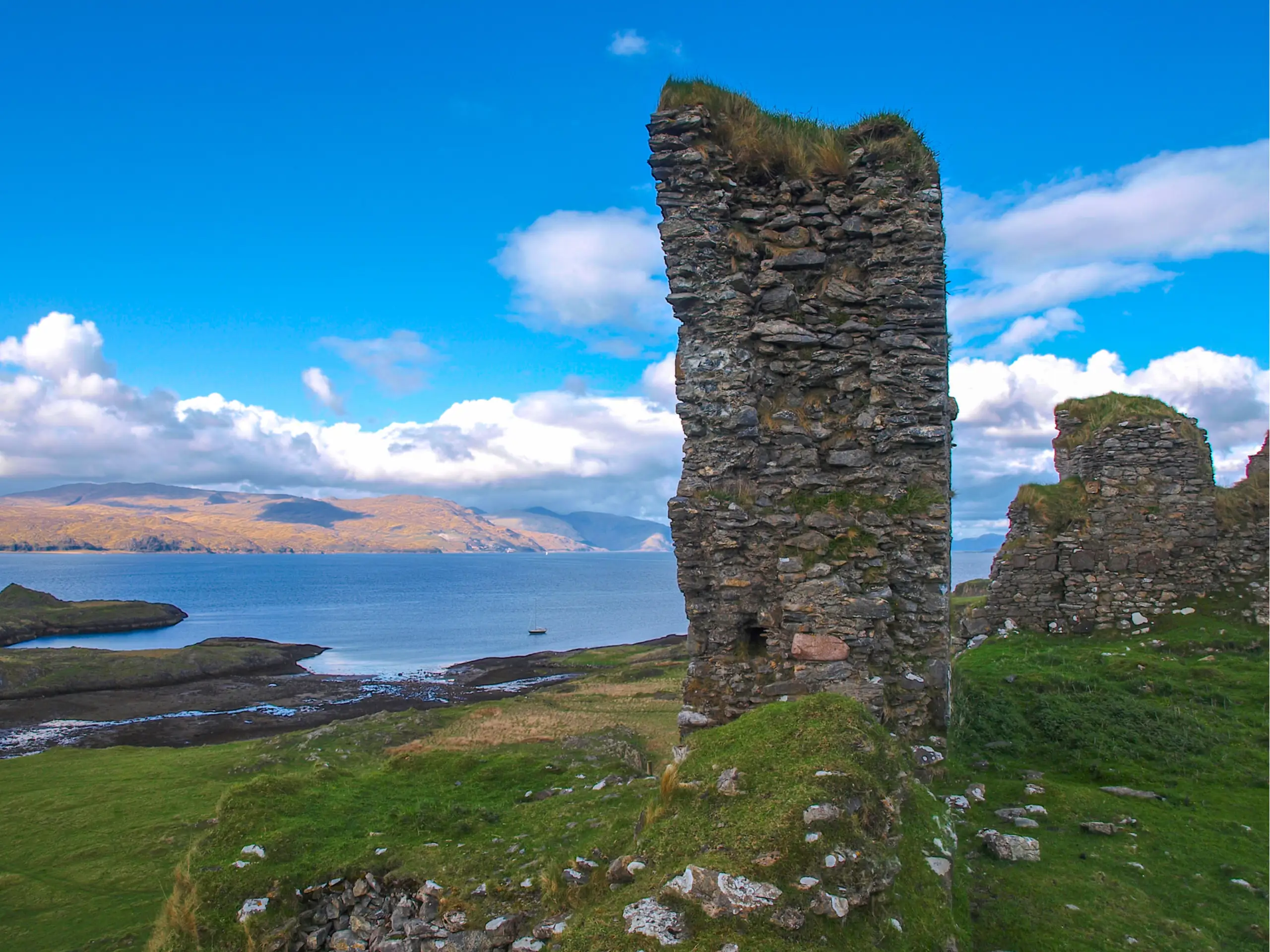 The remains of Achadun Castle overlooking Achadun bay (Glensanda quarry in the very far distance)