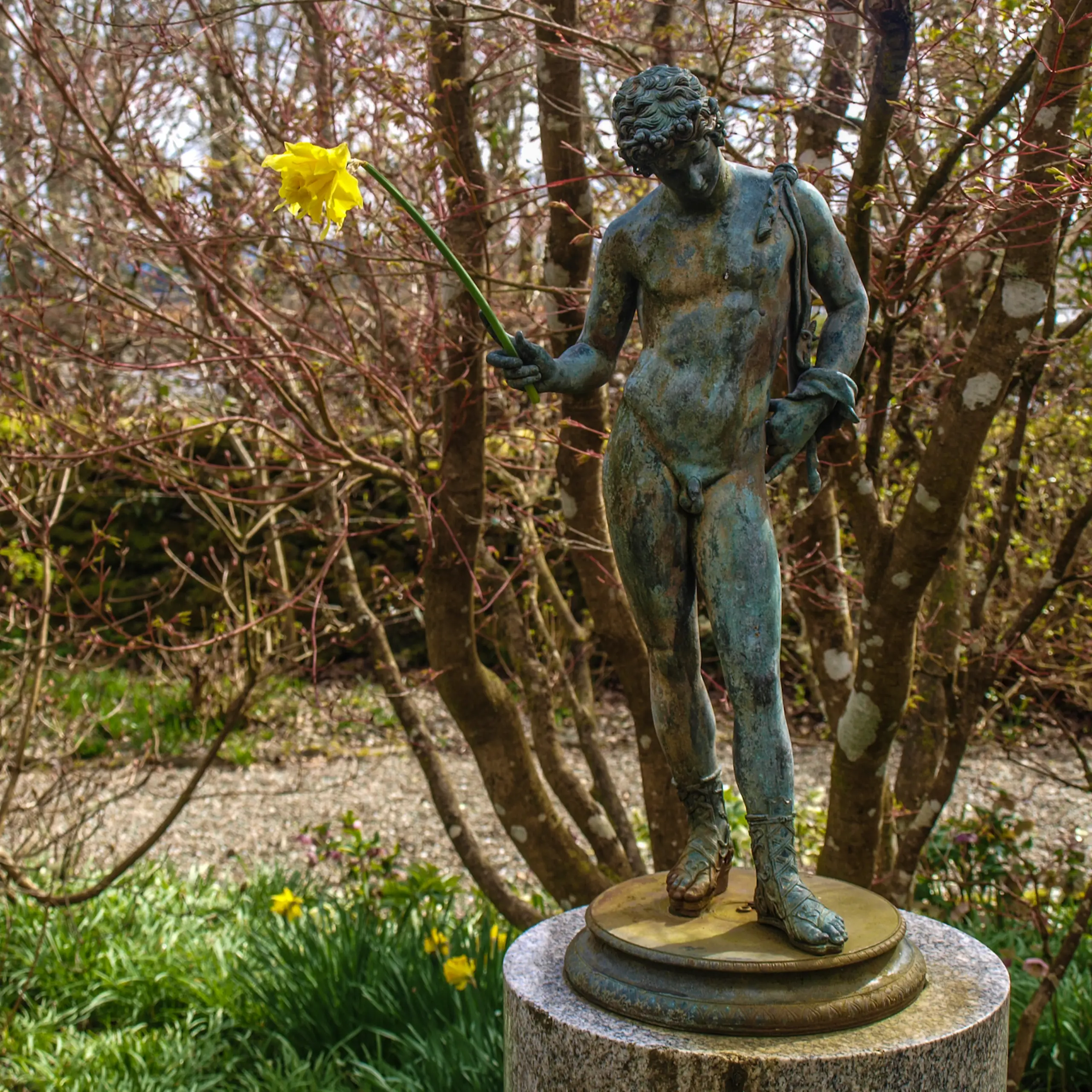 One of the garden sculptures, with a spring addition