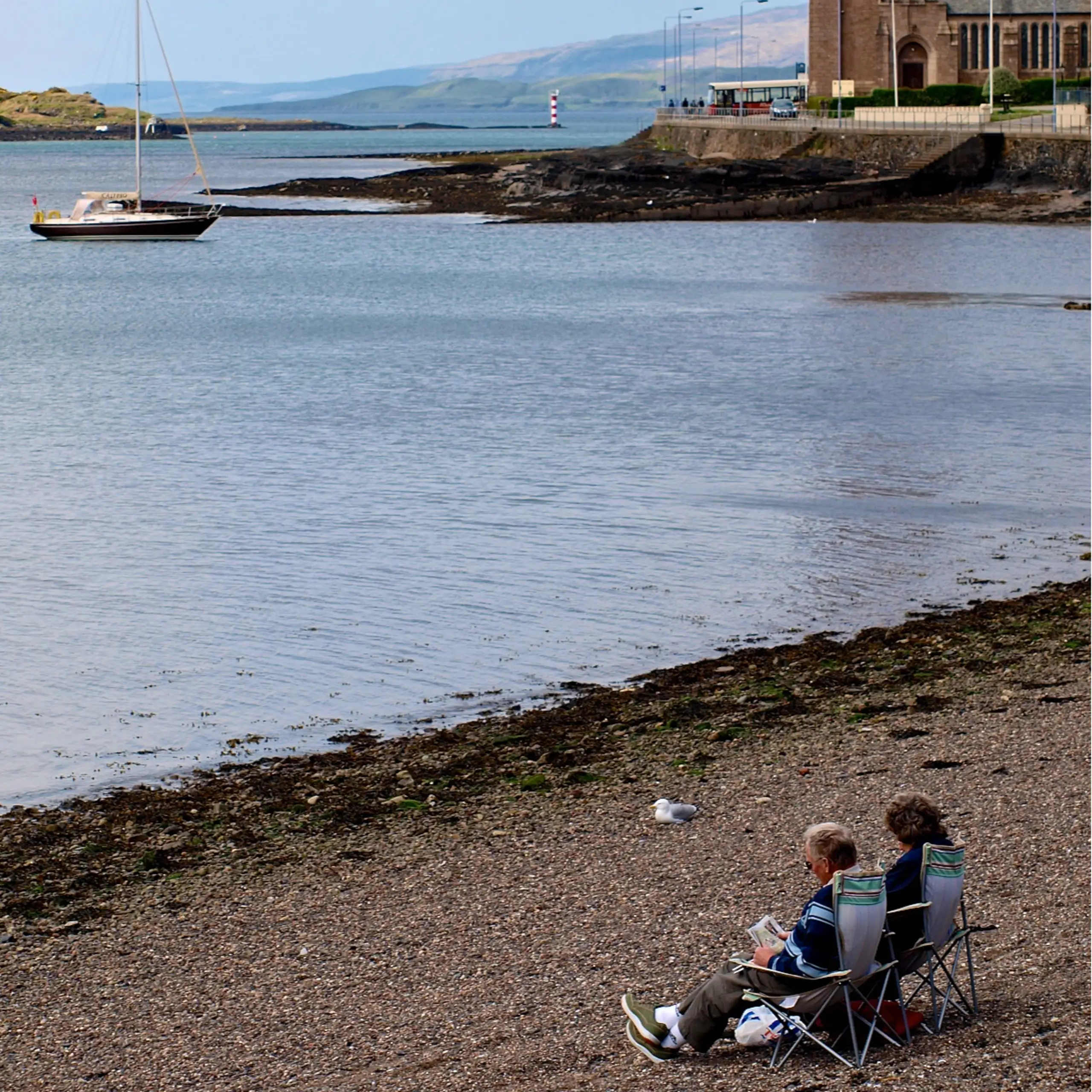 Relaxing on the very small scrap of a beach in the town